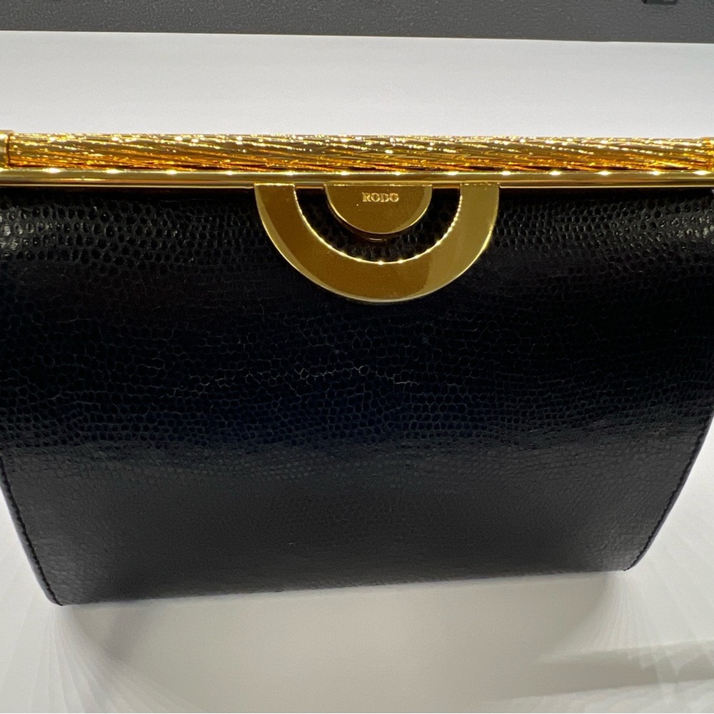 Rodo Black and Gold Clutch with Circular Hardware